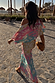Multicoloured Animal Print Tilly Dress with silver metallic flecks and a pleated texture in a vacation setting.