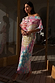 Animal Print Tilly Dress with multicoloured metallic flecks and a voluminous top on a sunlit wooden deck.