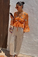 Apricot Embellished Top featuring mirror embroidery and a peplum hem, paired with silver sequin Naomi trousers.