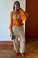 Thumbnail for Apricot Embellished Top with hand-embroidered mirrors, peplum hem and frill sleeves, styled with silver Naomi trousers.