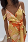 Apricot Strappy Vienna Dress featuring an orange fruit print, gold foil dots and a multi-wear wrap waist.
