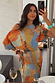 Thumbnail for Artist Tilly Dress in a multicoloured abstract print with a pleated texture, shown in a mirror selfie.