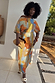 Thumbnail for Artist Tilly Dress in a multicoloured abstract print with a pleated texture, off-the-shoulder neck and fitted skirt.