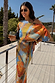 Artist Tilly Dress in a multicoloured abstract print and pleated plissé fabric, styled for a vacation.