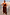 Thumbnail for Chocolate Balloon Jumpsuit featuring a draped silhouette, gathered neckline and slim straps on a smiling model.