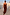 Thumbnail for Chocolate Balloon Jumpsuit with a draped silhouette and gathered neckline, shown on a model outdoors.