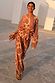 Model wearing peach Paisley Balloon Trousers and matching top as a summer co-ord.