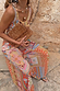 Dolce Vita Balloon Trousers featuring multi-coloured tile panels and sun motifs in a voluminous wide-leg fit.
