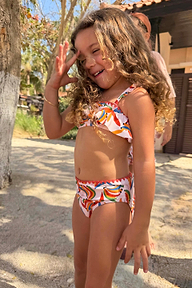 Girl's Banana Bikini in a multicoloured banana print with a frill bandeau top and matching bottoms.