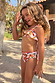 Girl's Banana Bikini in a multicoloured banana print with a frill bandeau top and matching bottoms.