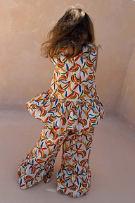 NFD Kids banana print cotton co-ord with a sleeveless peplum top and flared trousers.