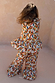 NFD Kids banana print cotton co-ord with a sleeveless peplum top and flared trousers.