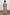 Thumbnail for Banana Saige Skirt in a multicolour banana print with a tiered frill hem, styled as a cotton co-ord from behind.