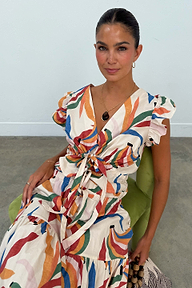 Banana Kerri Top in a colourful banana print with a tie front and puff sleeves, paired with the matching skirt.