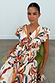 Banana Kerri Top in a colourful banana print with a tie front and puff sleeves, paired with the matching skirt.