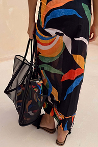 Black Mesh Tote Bag featuring a banana print pouch and leather straps, styled with a matching banana print skirt.