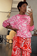 Pink Bandana Copenhagen Jumper with a white paisley print and matching red joggers for an iconic co-ord look.