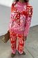 Pink Bandana Copenhagen Jumper in an iconic red and pink print with a neck tie and matching knit joggers.