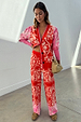 Red Bandana Martha Cardigan with a red and pink bandana print, worn as a co-ord with matching knit trousers.