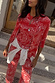Red Bandana Alexa Cardigan in a ribbed paisley print, styled as a co-ord with a white shirt tied at the waist.