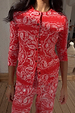 Red Bandana Alexa Cardigan in a ribbed fabric with white paisley print and front button fastening.