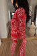 Red Bandana Alexa Cardigan in ribbed stretch fabric with an iconic bandana print, shown in a side profile.
