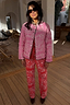 Reversible pink quilted jacket with a bandana print and leopard trim, paired with matching red bandana trousers.