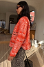 Red Bandana Reversible Jacket featuring a quilted paisley print and leopard trim, paired with leopard print trousers.