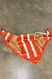 Multi Stripe Mix Bandana featuring orange, tan and white stripes and a polka dot border, displayed on a concrete floor.