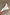 Thumbnail for Multi Stripe Mix Bandana featuring bold orange and blue stripes and a polka dot border, draped on a grey concrete floor.