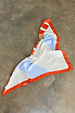 Multi Stripe Mix Bandana featuring bold orange and blue stripes and a polka dot border, draped on a grey concrete floor.