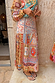 Pleated Dolce Vita Freya Skirt in a colourful tile patchwork print with an asymmetric yoke, designed in London.