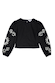 Black cotton Enchanted Lillie Top featuring white embroidered celestial motifs on voluminous blouson sleeves.