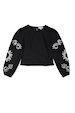 Black cotton Enchanted Lillie Top featuring white embroidered celestial motifs on voluminous blouson sleeves.