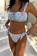 Blue Dreamer Tie Side Brief in a light blue sun and palm print, featuring adjustable side ties.