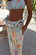 Blue Dreamer Tie Side Brief featuring a celestial sun and star print, layered under matching printed trousers.