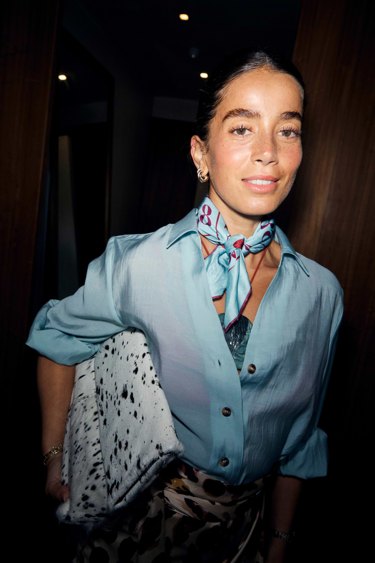 Bingo Bandana in a blue and red colourway with iconic lips motifs, worn tied around the neck.