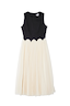 Thumbnail for Black and Cream Monika Dress with a sleeveless corset top, scalloped waist and a cream pleated tulle mesh midi skirt.