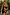 Thumbnail for Black Banana Bandeau Swimsuit with multi-colour embroidered motifs and ruched tie sides in a tropical setting.