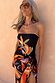 Black Banana Bandeau Swimsuit featuring multi-colour embroidered motifs, paired with a coordinating printed sarong.