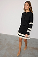 Black and Cream Fringe Jake Skirt in a knit fabric featuring tiered fringe and a matching knit cardigan.