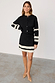 Black and Cream Fringe Jake Skirt with tiered cream fringing, styled as a matching knitted co-ord set.