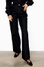 Black Scallop Detail Jeans in a wide leg silhouette, styled with a black shirt and mesh ballet flats.