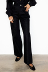Black Scallop Detail Jeans in a wide leg silhouette, styled with a black shirt and mesh ballet flats.
