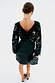 Black vegan leather mini Jaspre skirt styled with an embroidered cardigan and leopard print heels.