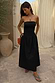Black Lola Mid-axi Dress with a ruched bodice and flowy cotton skirt, styled for a summer vacation.