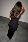 Black Molly midi dress with tiered ruffles and spaghetti straps, shown from behind on a model.
