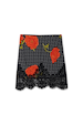 Black Poppy Mini Maeva Skirt featuring a red poppy and polka dot print with a black lace trim.