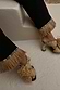 Thumbnail for Black Raffia Marra Trousers featuring fringe hems, styled with woven raffia heels on white steps.