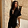 Black Raffia Shirt with fringed short sleeves and shell buttons, styled with a shell necklace.